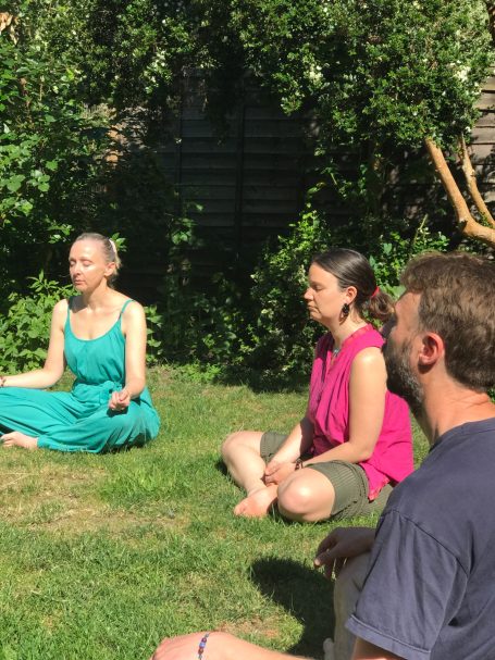 Meditation practice outdoors in a wellbeing session