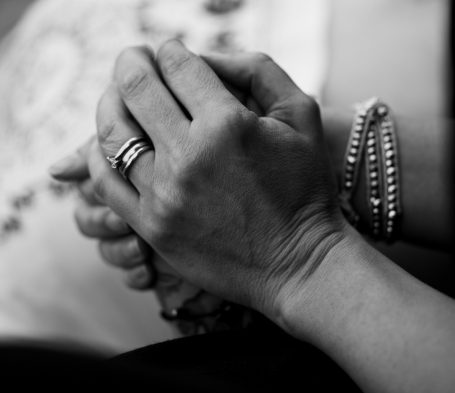 Holding hand of client